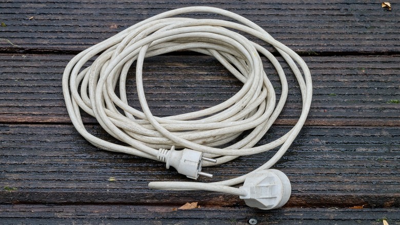 an extension cord on a wooden surface