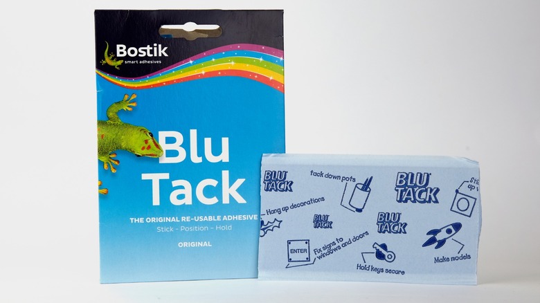 a pack of Blu Tack on a white background