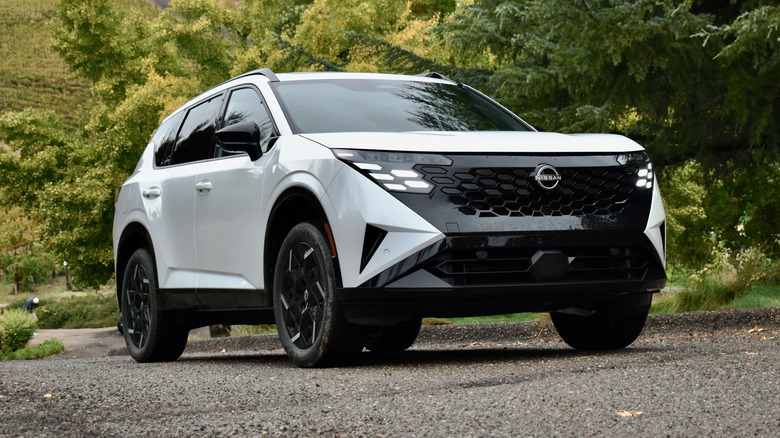 2027 Nissan Rogue Hybrid driving.