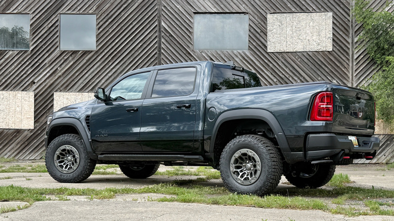 2027 Ram TRX SRT rear 3/4 parked in a concrete lot
