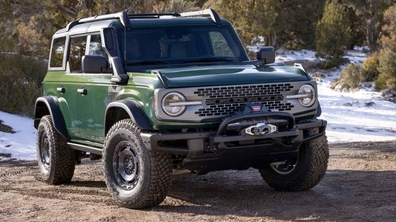 Ford Bronco Everglades parked off-road with snow-covered paths in the background