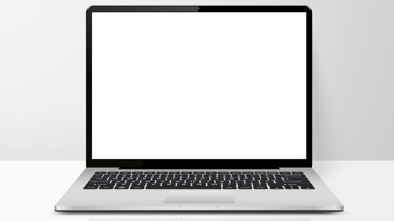 Silver laptop with a blank white screen on a desk