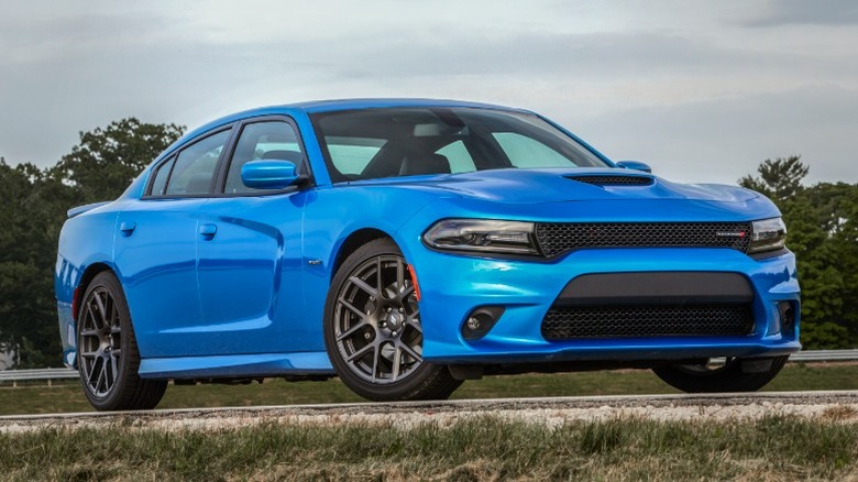 Blue Dodge Charger R/T parked on a rural road