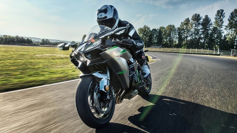 Motorcyclist riding 2026 Kawasaki Ninja H2 ABS on track