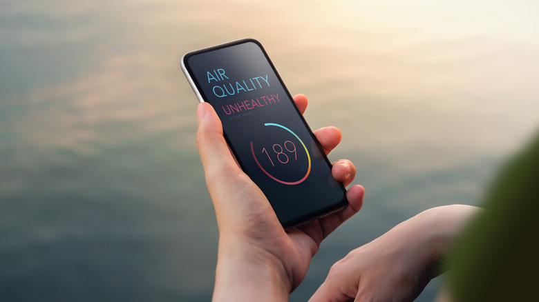 air quality display on a smartphone reads unhealthy