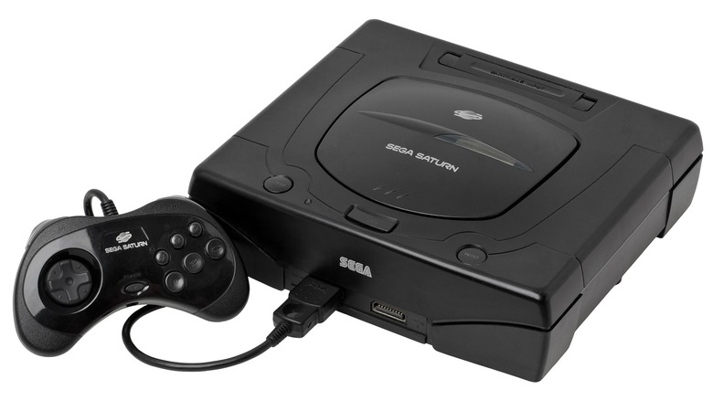 The Sega Saturn console and its controller