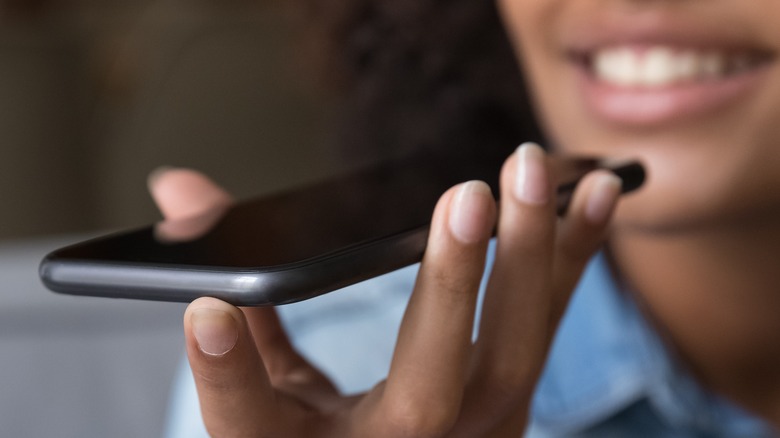 Woman holding phone talking