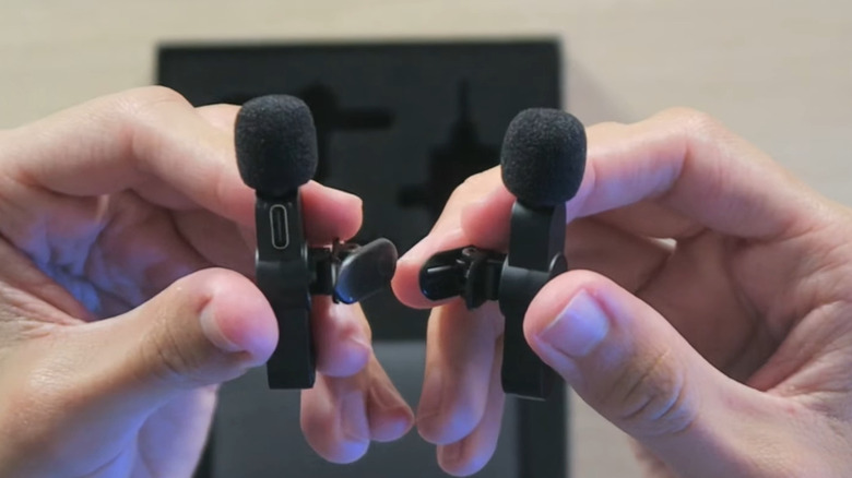 Holding two microphones