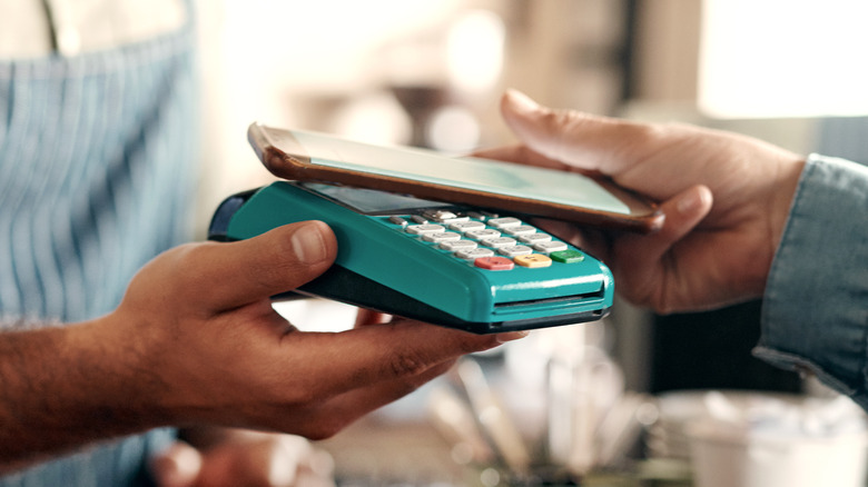 person pays using phone