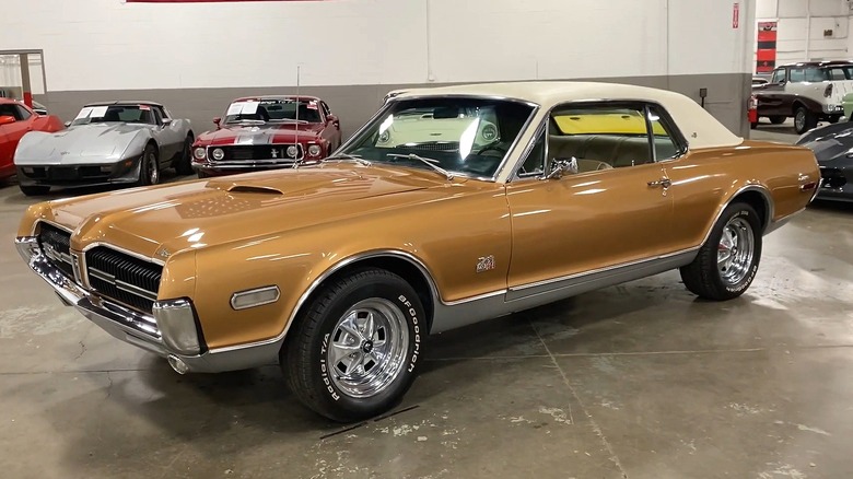 A brown 1968 Mercury Cougar GT-E with a white vinyl roof.