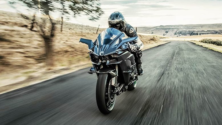 The supercharged Kawasaki Ninja H2R riding on a country road