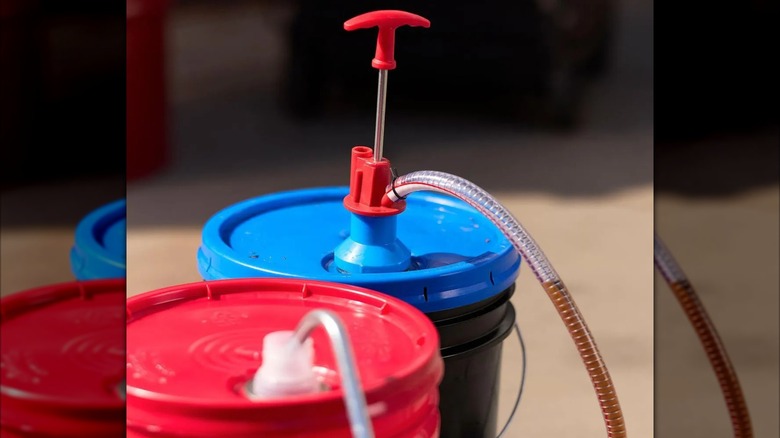 Pittsburgh 5-Gallon Pail Pump connecting two buckets