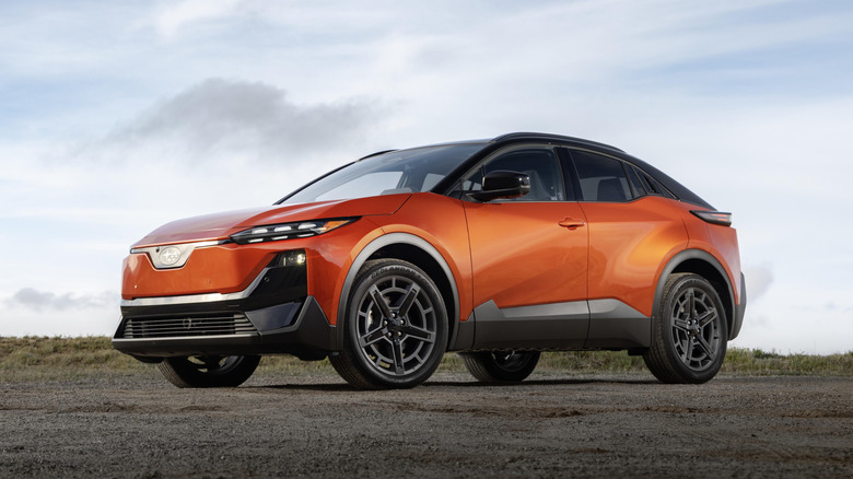 An orange 2026 Subaru Uncharted parked in a dirt lot