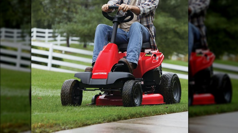 man riding lawn mower