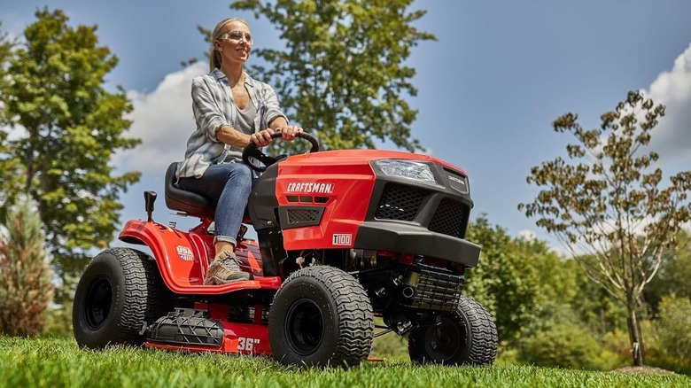 woman riding craftsman lawn mower