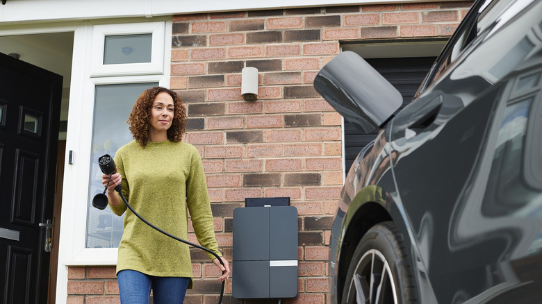 homeowner charging electric car