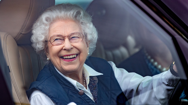 Queen Elizabeth driving Rolls Royce