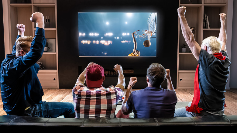 group of people in front of TV