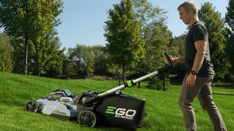 Person mowing lawn with Ego Power+ 800 Series 56V 21-inch Select Cut Mower