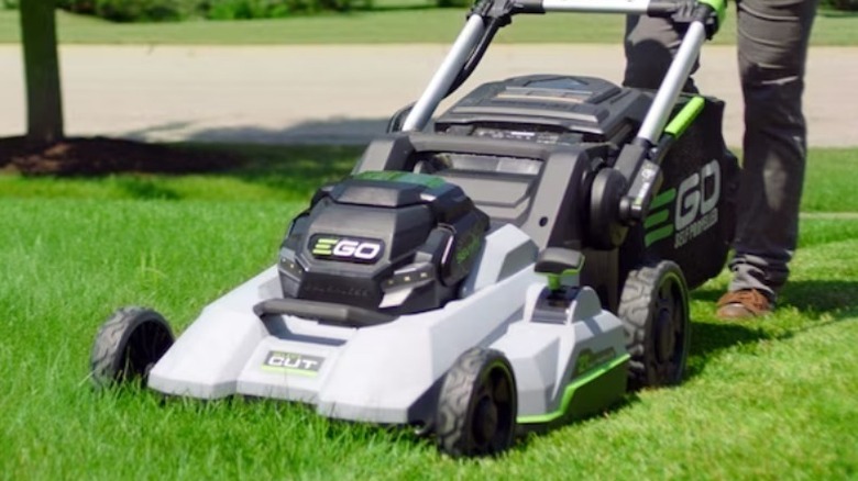 Person mowing lawn with Ego Power+ 800 Series 56V 21-inch Select Cut Mower