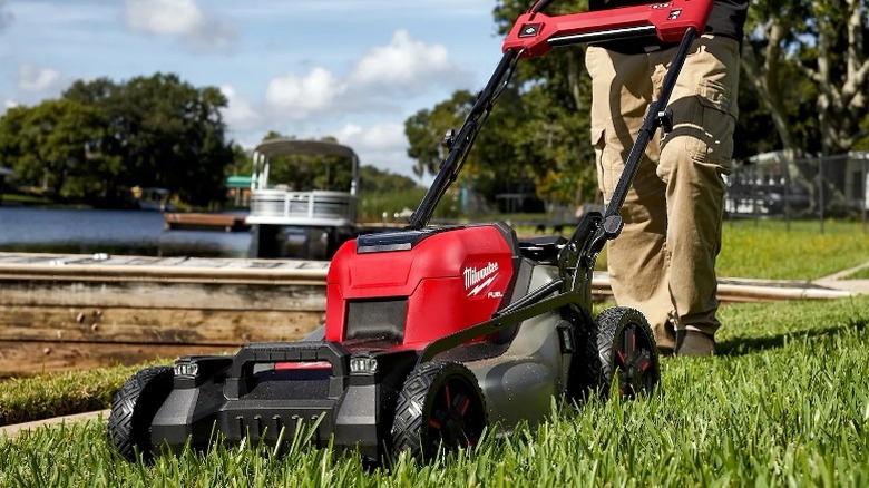 Person mowing lawn with Milwaukee M18 Fuel 21-inch Dual Battery Mower