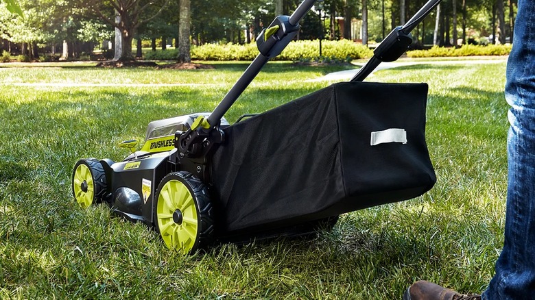 Person mowing lawn with Ryobi 40V HP Brushless 20-inch Self-Propelled Mower