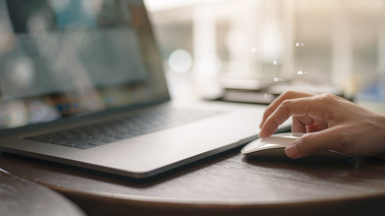 Woman clicking a mouse. 