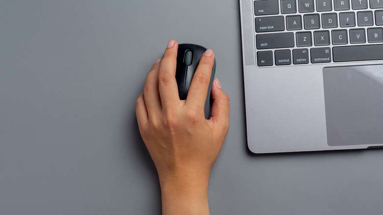 Woman using a computer mouse.