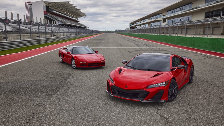 Two Acura NSX cars, first-generation behind the 2022 NSX Type S