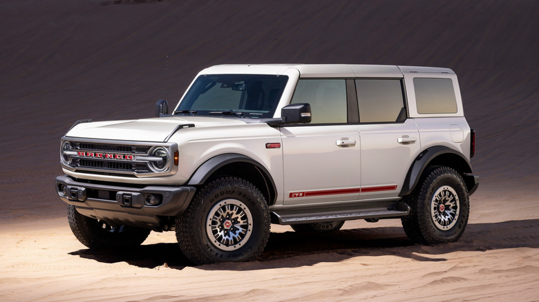 2026 Ford Bronco Anniversary Package parked in sand dunes, front-left view