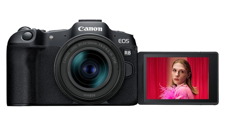 a Canon EOS R8 with a Canon RF24-50mm f/4.5-6.3 IS STM lens and its articulating LCD screen flipped towards the front