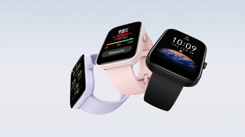 The Amazfit Bip 3 smartwatch in grey, pink, and black