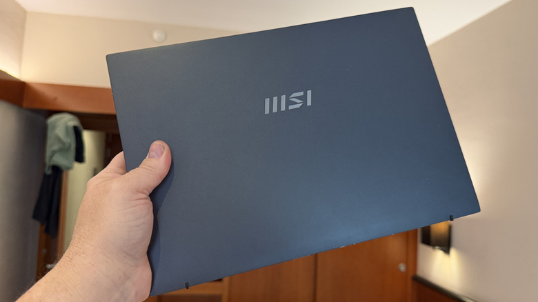 Man holding an MSI laptop
