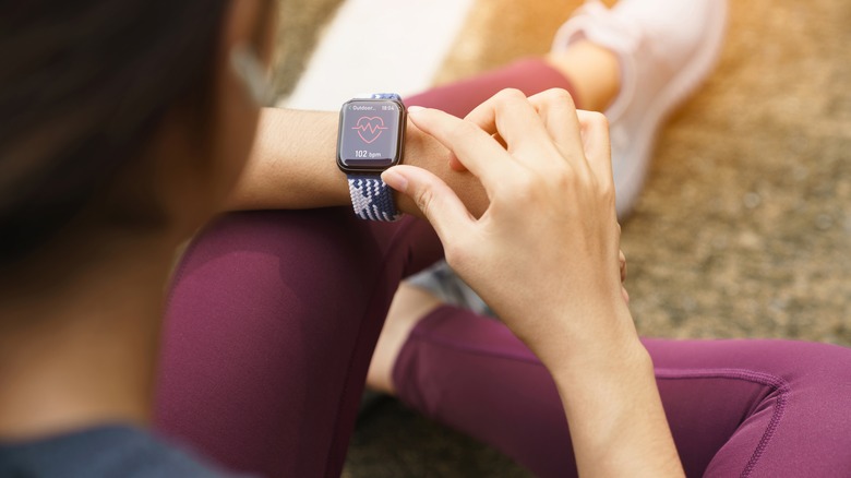 Person using Apple Watch outdoors