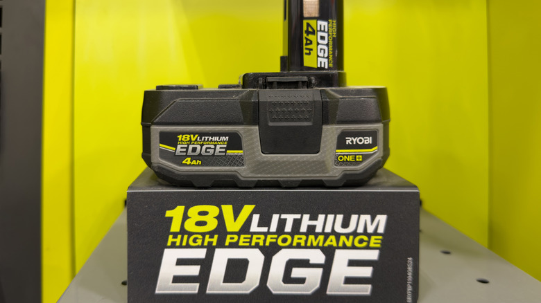 A Ryobi 18V Lithium High Performance Edge battery in a yellow background