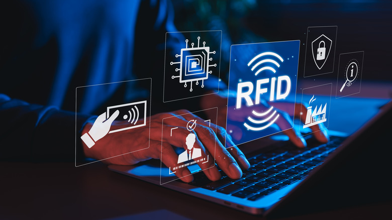 Person using laptop with digital icons illustrating RFID tech