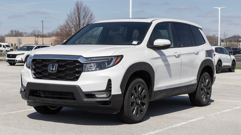 White Honda Passport on a car lot