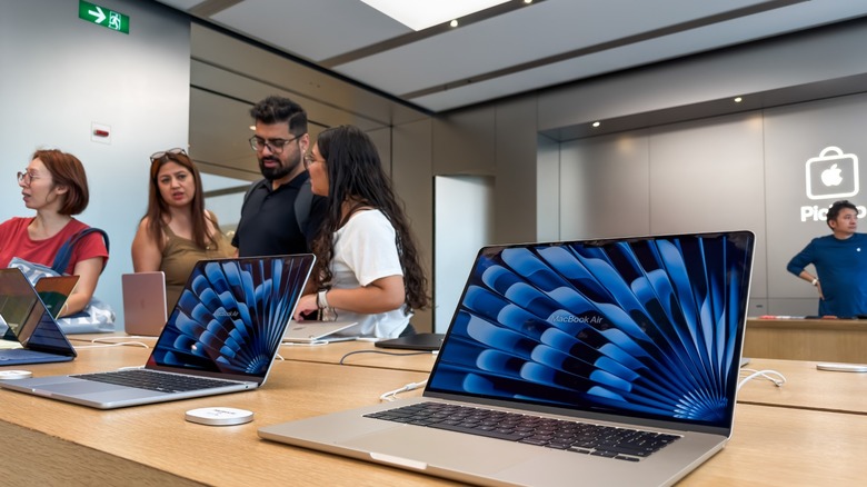 MacBooks on display at an Apple store