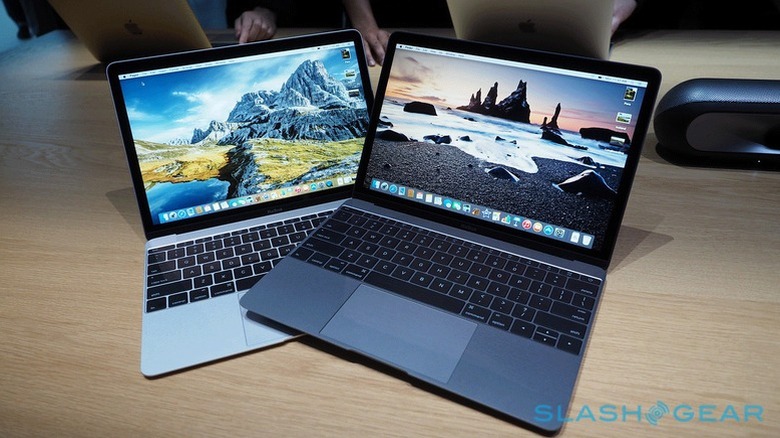 Two 2015 MacBooks on a  table
