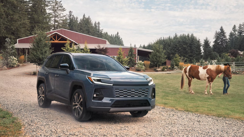 2026 Toyota RAV4 at farm with horse