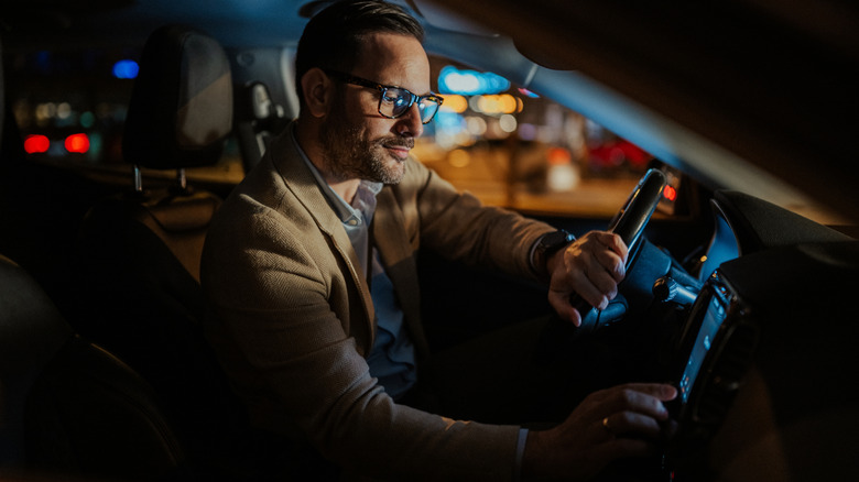 A man using his car's display