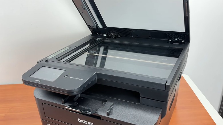 A Brother printer's scanning deck opened