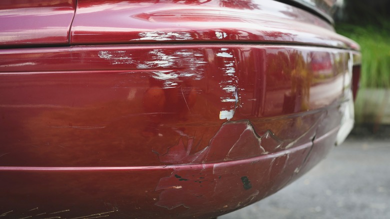 Scratched cracked car bumper