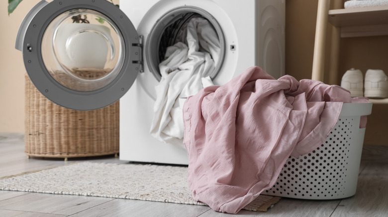 An unbranded front-load washing machine with a laundry basket in front