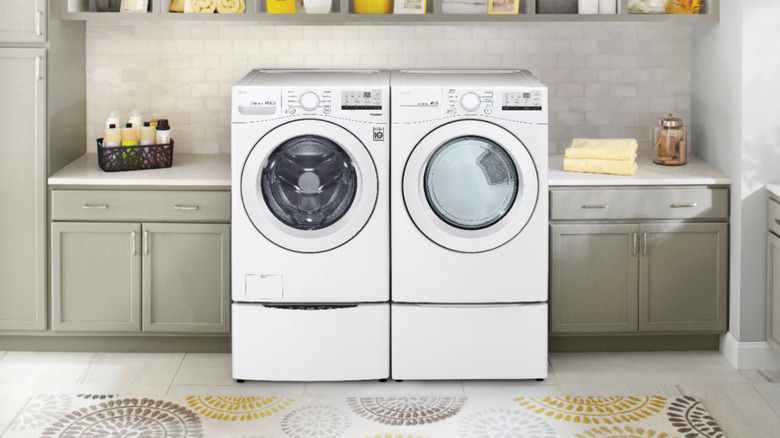 An LG WM3400CW washing machine and a dryer in a kitchen