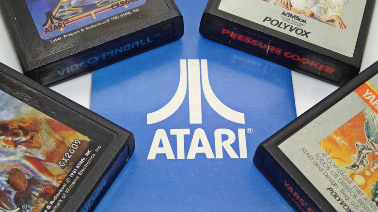 Atari logo with game cartridges