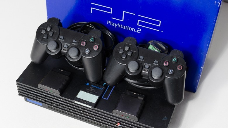 PlayStation 2 slim with controllers