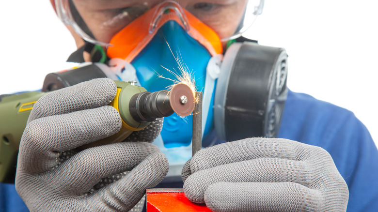 locksmith using a dremel rotary tool