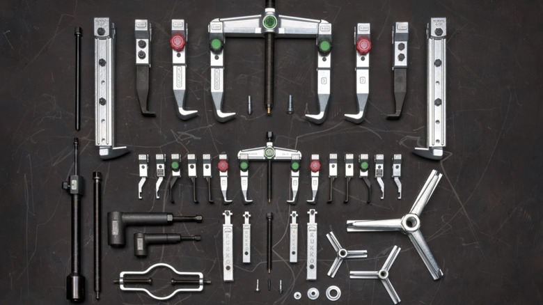 Various Kukko pulling tools arranged on a black background