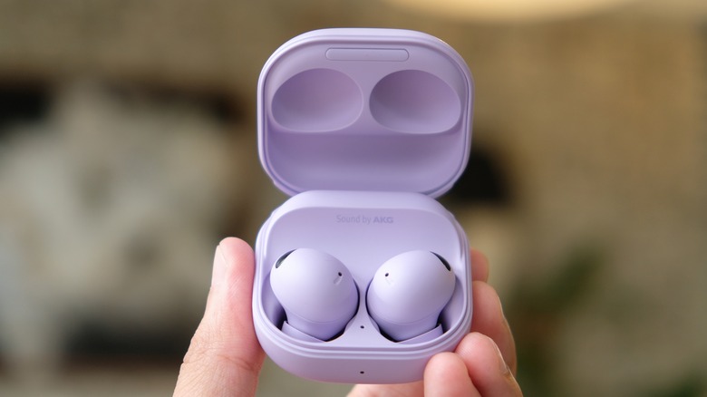 A hand holding Samsung Galaxy Buds2 Pro